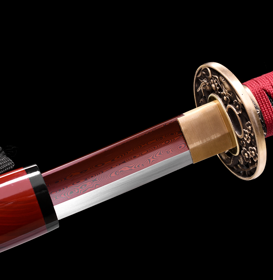 Red-finished pattern-welded blade and copper fittings of the Vermilion Dragon katana